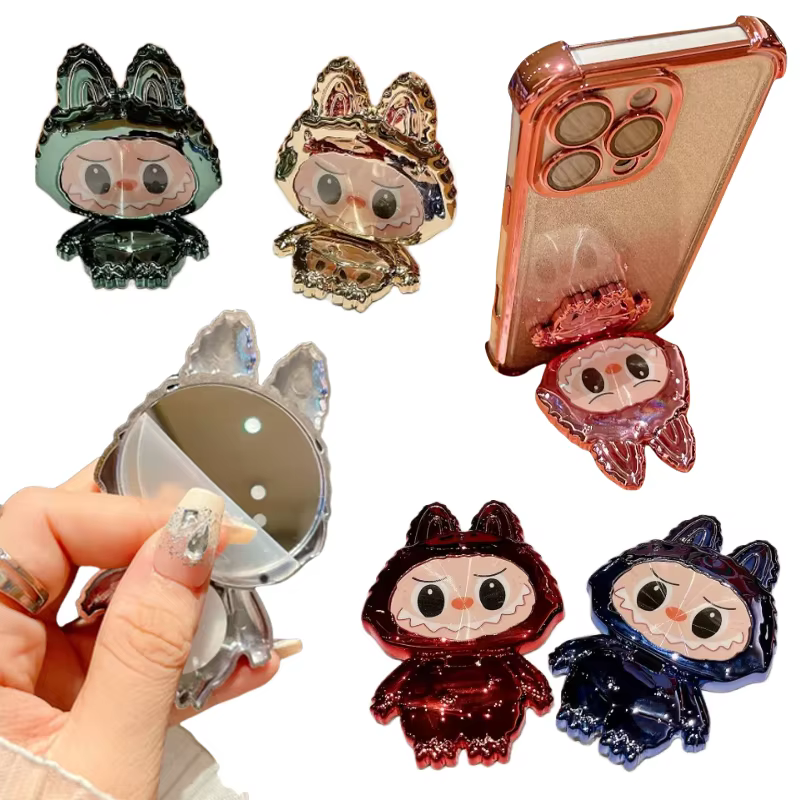 Presenta con orgullo la nueva serie Labubued. Estas figuras de estilo caricaturesco pueden servir como soportes para celulares, adorables y coloridos adornos de escritorio para amantes del maquillaje, y creativos soportes de escritorio para regalos.