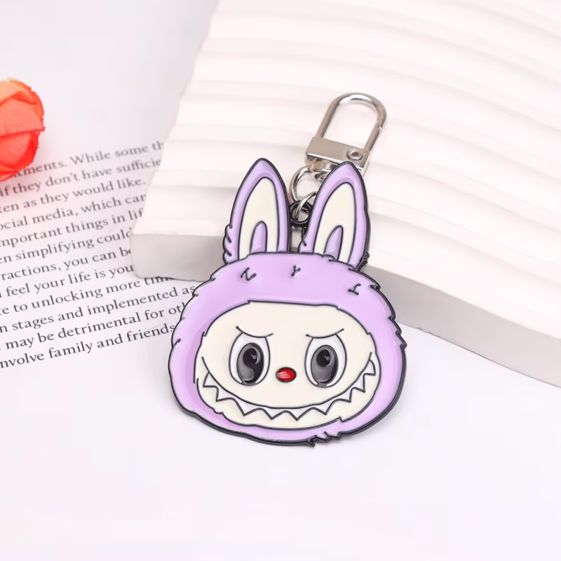 Labubu Lazo de 9 dientes de monstruo con forma de figura de anime, lazo con colgante esmaltado de aleación a la moda, joyería, llave hermosa, accesorios para bolso